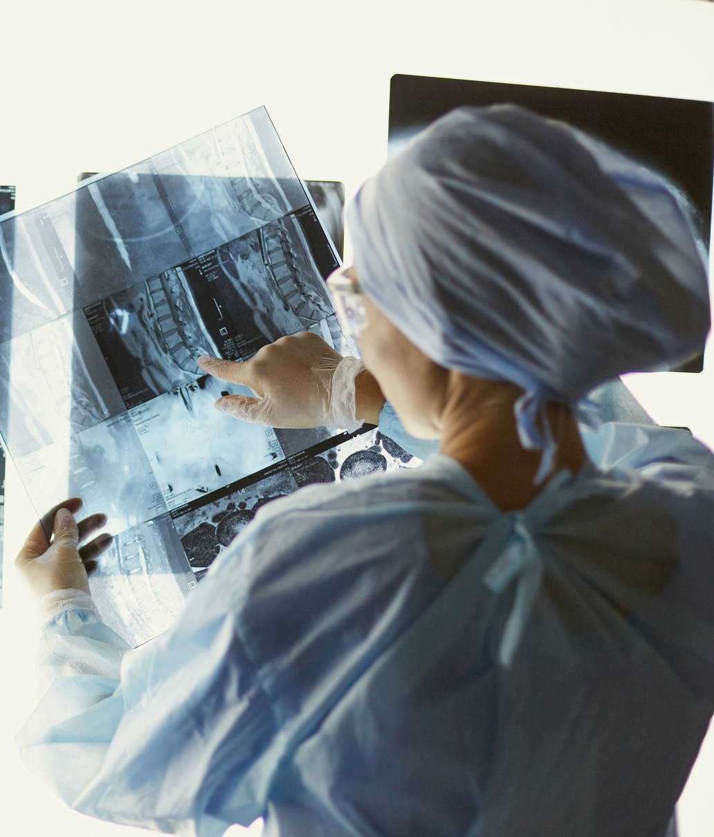 Two female women medical doctors looking at x-rays in a hospita