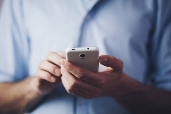 man hand phone